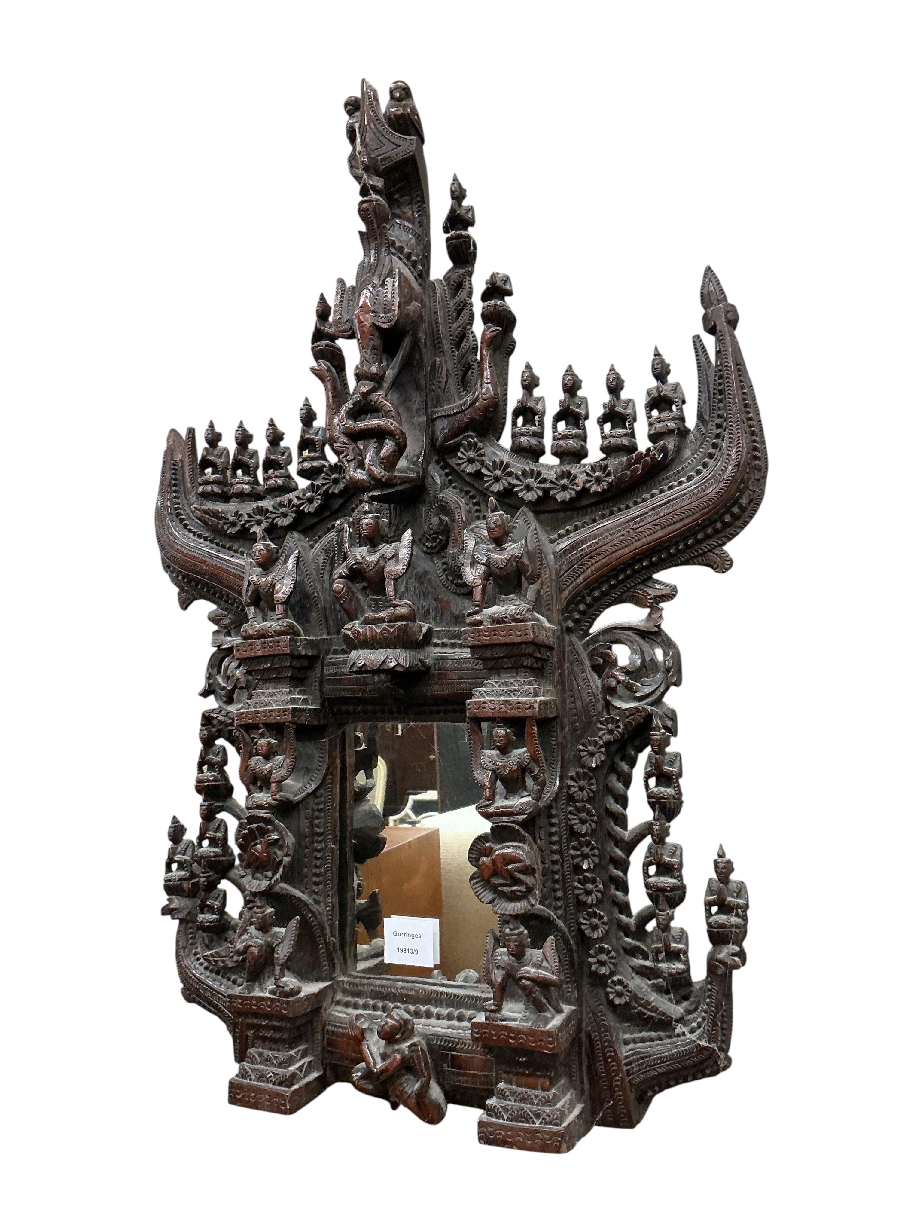 A Thai carved hardwood shrine, width 50cm, height 74cm